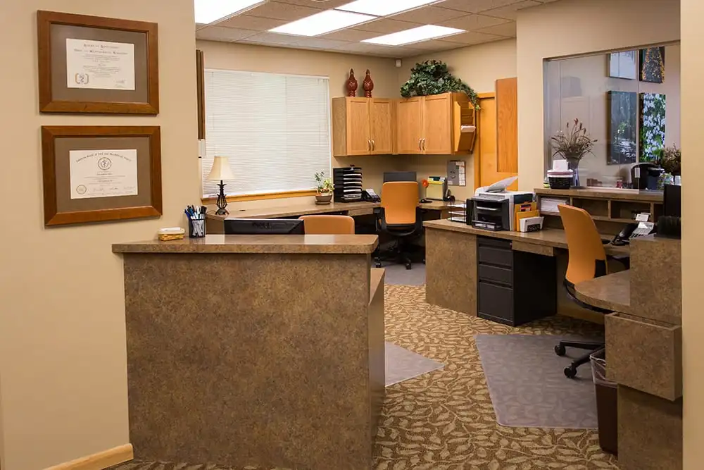 Behind front desk