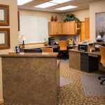 Behind front desk